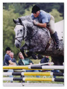 John Blair of Fox Gate Farms jumps Sir Norman of Tivorton. Photo Credit: Reflections of Killington, Inc.