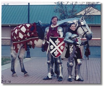 Spanish-Norman stallion Romntico H.H.F. shown with rider Amber Talarico and armor-maker Jeff Mann after a performance at Equine Affaire 1998 in W. Springfield, Massachusetts.